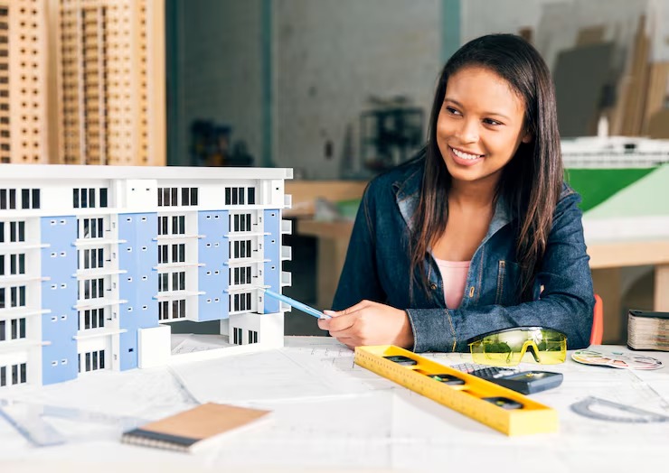 imgi 15 smiling african american woman showing model building 23 2148039856